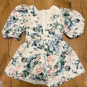 IVORY MULTIFLORAL PUFF SLEEVE ROMPER